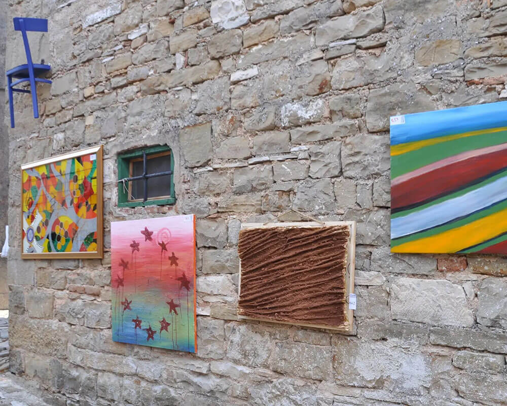 Cobblestone street in Grožnjan with art galleries and stone facades